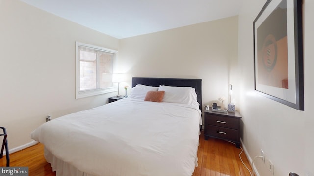 bedroom with light wood-type flooring