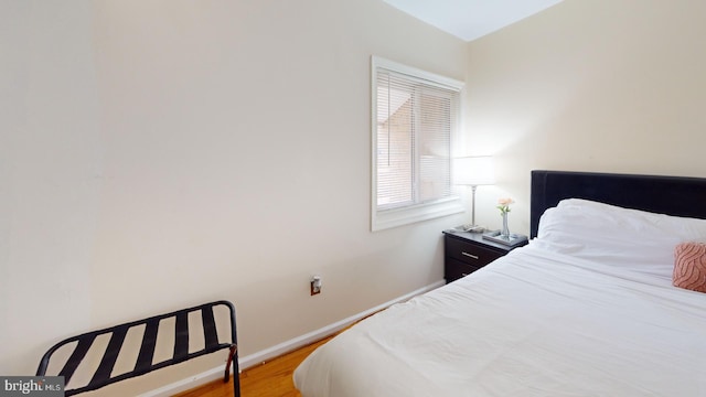 bedroom with light wood-type flooring