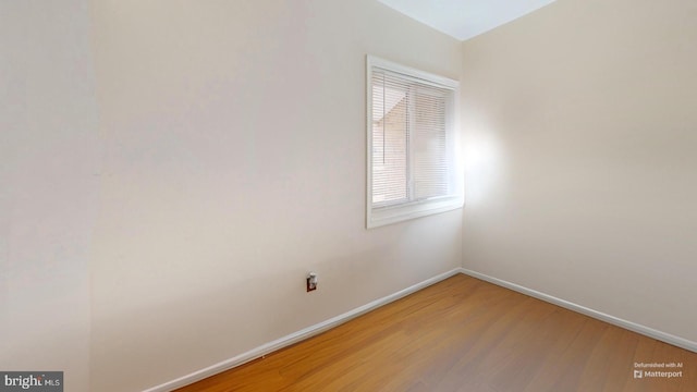 empty room featuring hardwood / wood-style flooring