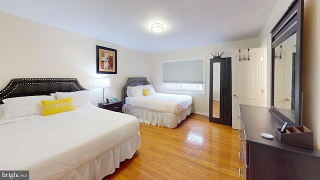 bedroom with light hardwood / wood-style flooring