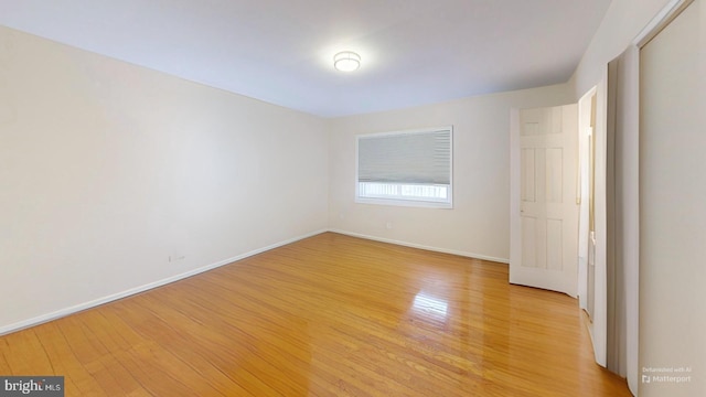 spare room featuring light wood-type flooring