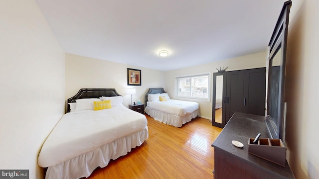 bedroom with wood-type flooring