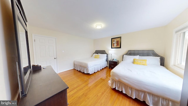 bedroom with hardwood / wood-style floors