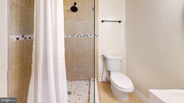 bathroom with toilet, tile patterned floors, and a shower with curtain