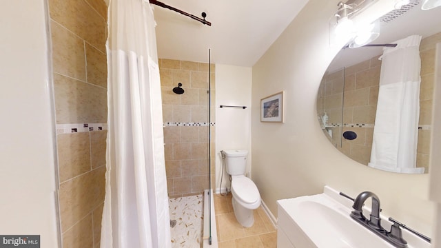 bathroom featuring walk in shower, tile patterned floors, toilet, and vanity