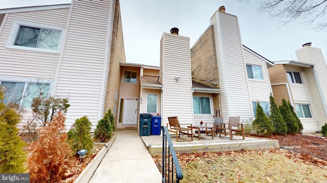 rear view of property featuring a patio