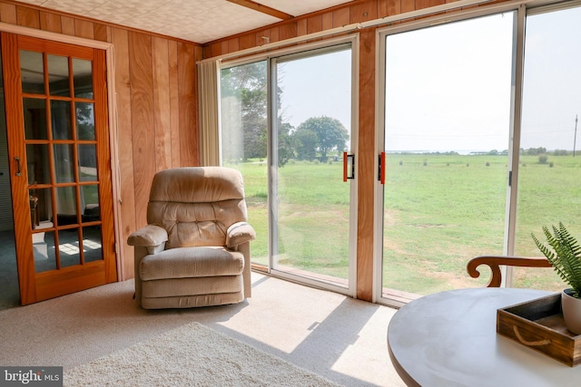 sunroom featuring a rural view