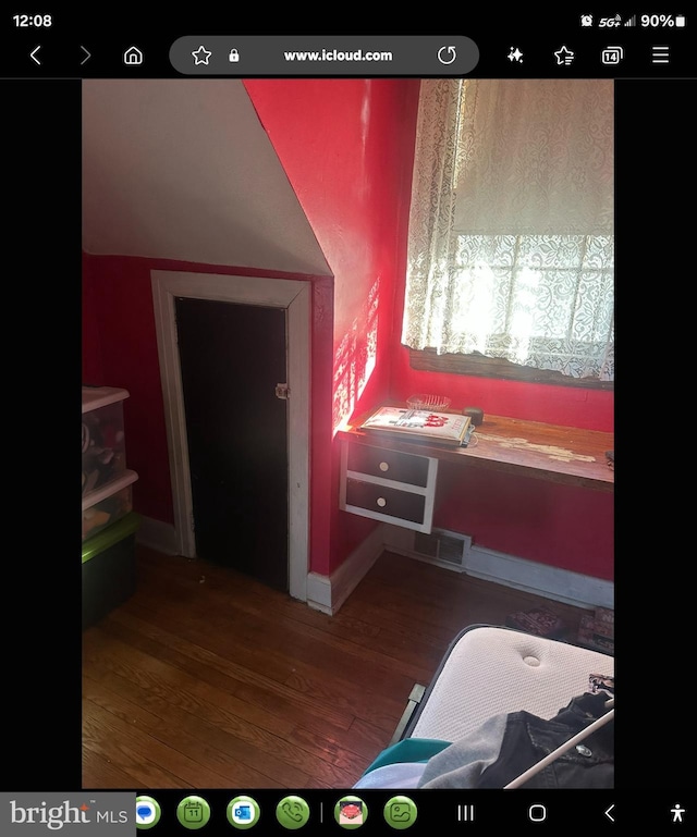 bathroom with hardwood / wood-style flooring