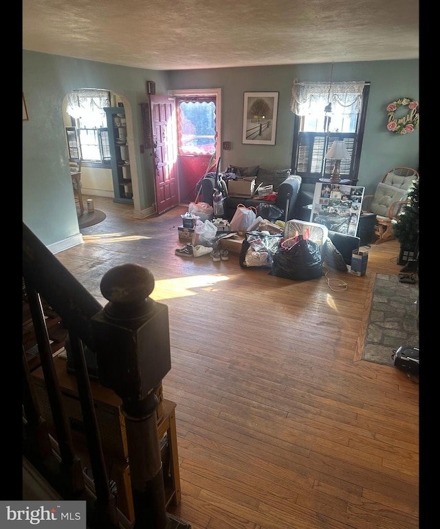 living room featuring hardwood / wood-style floors and a textured ceiling