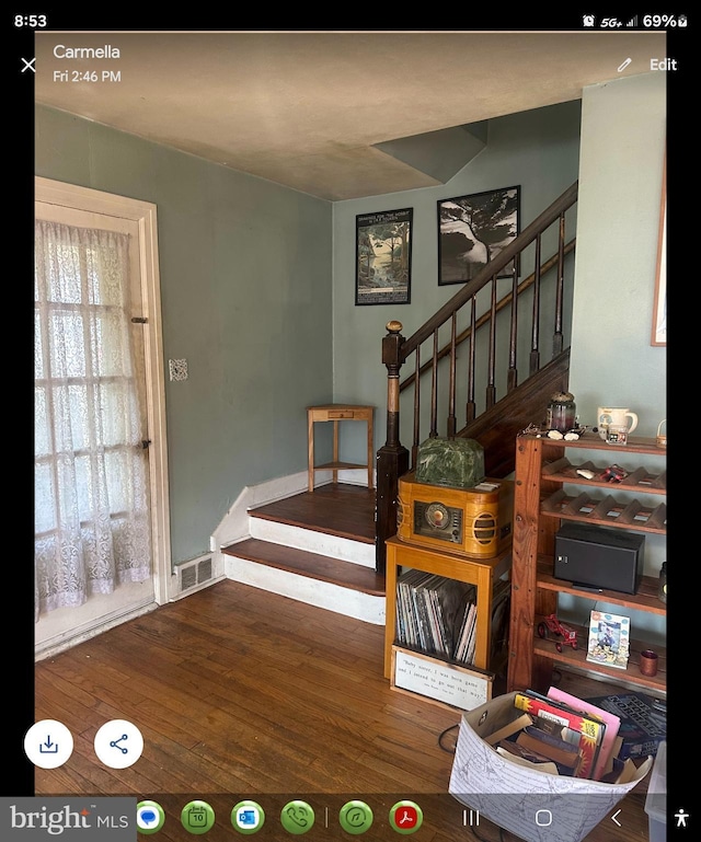 stairs with wood-type flooring