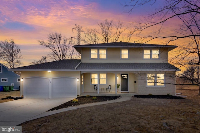 view of front of home featuring a garage and covered porch