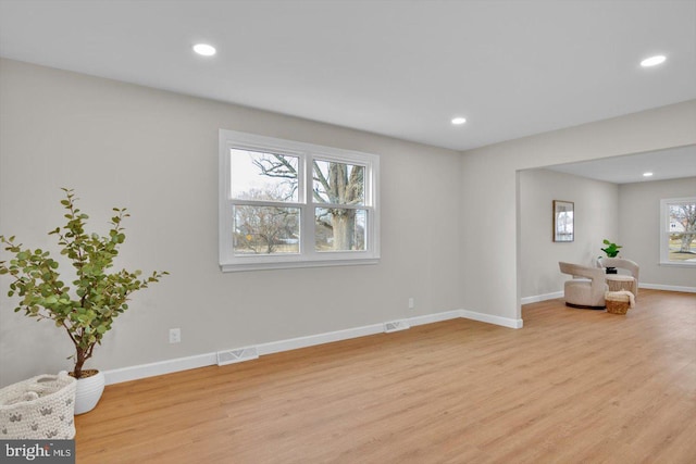 unfurnished room with light hardwood / wood-style floors