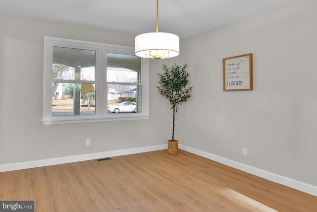 empty room featuring hardwood / wood-style flooring