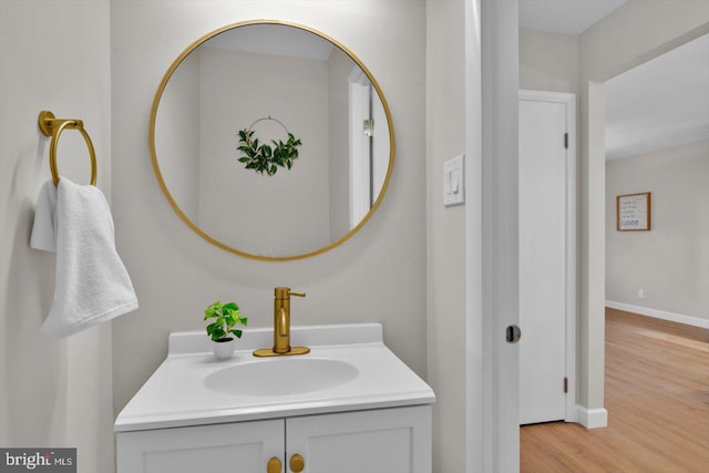 bathroom with vanity and hardwood / wood-style floors