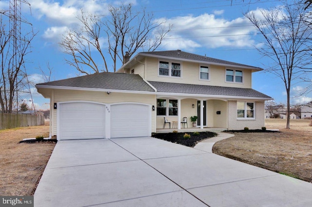 front of property featuring a garage and covered porch