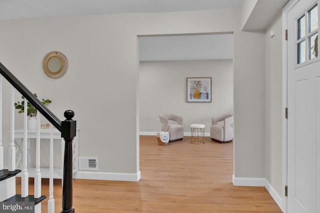 entryway with light hardwood / wood-style flooring