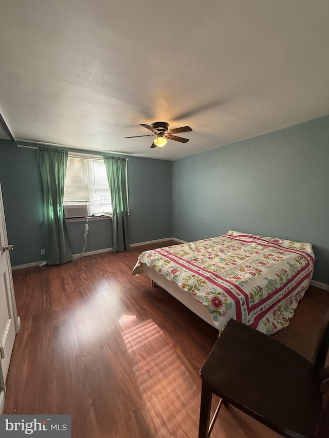 bedroom featuring hardwood / wood-style flooring and ceiling fan