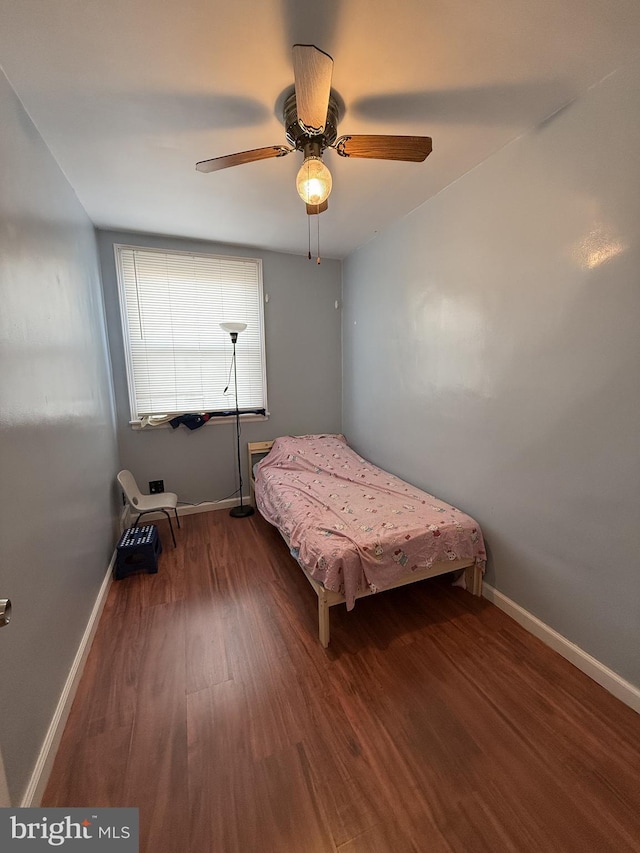 bedroom with hardwood / wood-style flooring and ceiling fan