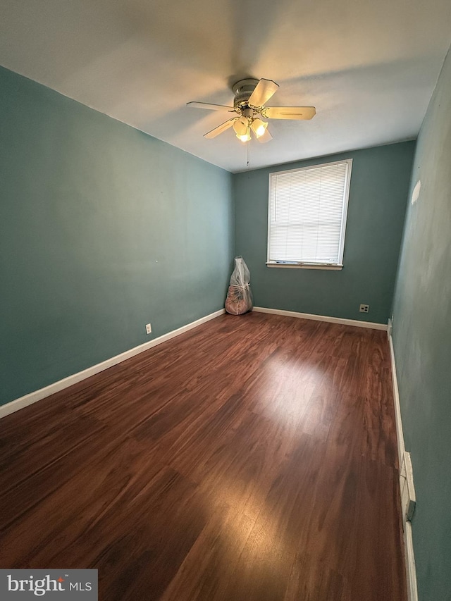 unfurnished room featuring hardwood / wood-style floors and ceiling fan