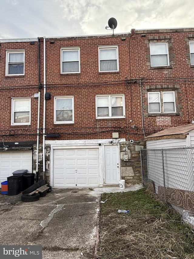 rear view of house with a garage