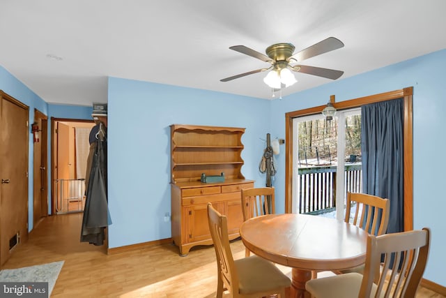 dining space featuring ceiling fan and light wood-type flooring