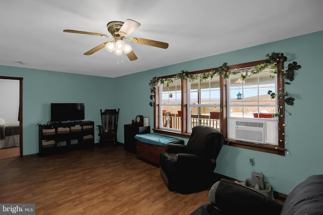 living room with hardwood / wood-style flooring, plenty of natural light, cooling unit, and ceiling fan