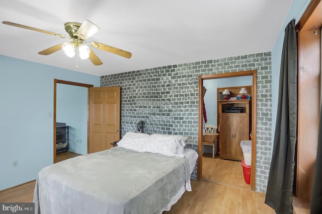 bedroom featuring ceiling fan and light hardwood / wood-style flooring