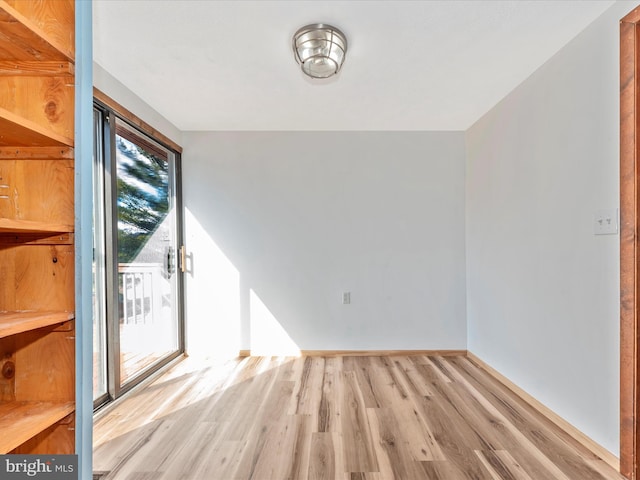 spare room with light hardwood / wood-style flooring