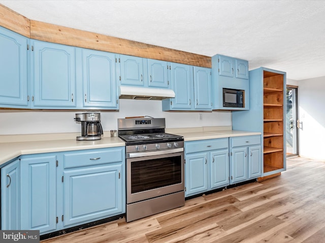 kitchen featuring blue cabinets, gas range, black microwave, and light wood-type flooring