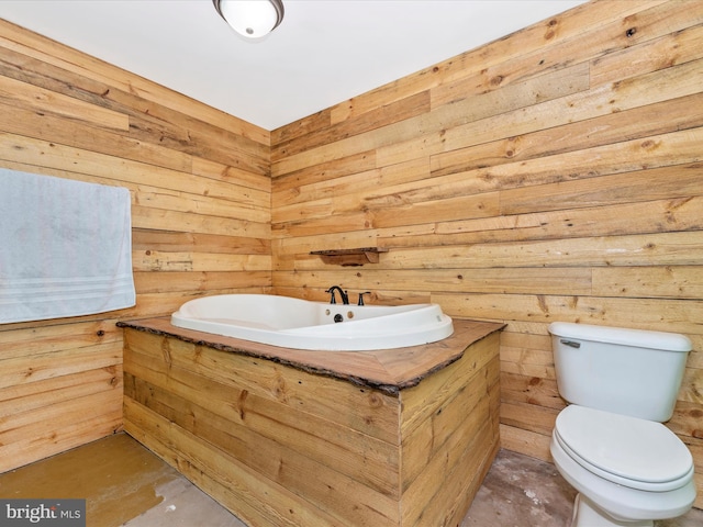 bathroom with wood walls and toilet