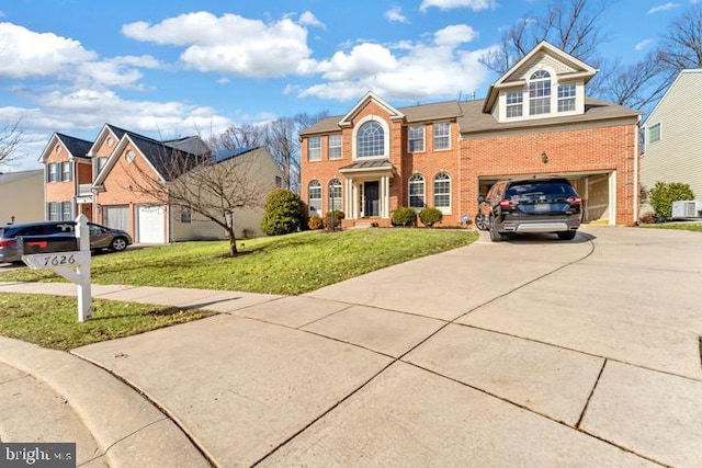 view of front of home with a garage and a front yard