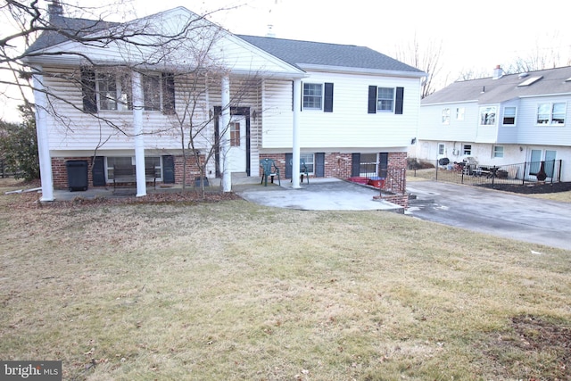 view of front of property with a front lawn and a patio area