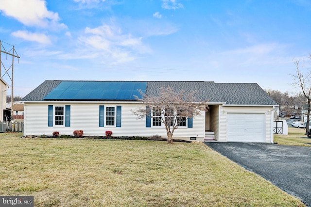 single story home featuring a garage, central AC, a front lawn, and solar panels