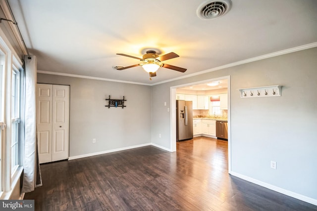 unfurnished room featuring sink, crown molding, dark hardwood / wood-style floors, and ceiling fan