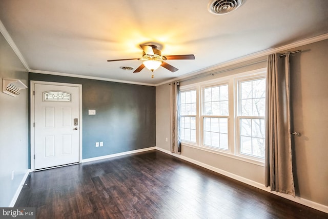 entryway featuring ornamental molding, ceiling fan, and dark hardwood / wood-style flooring