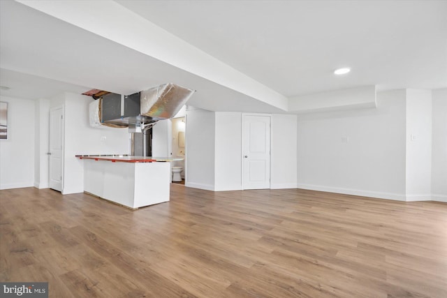 interior space with recessed lighting, baseboards, and light wood-style floors