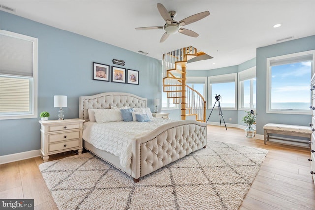 bedroom featuring ceiling fan and light wood-type flooring