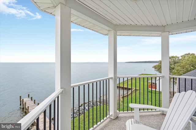 balcony featuring a water view