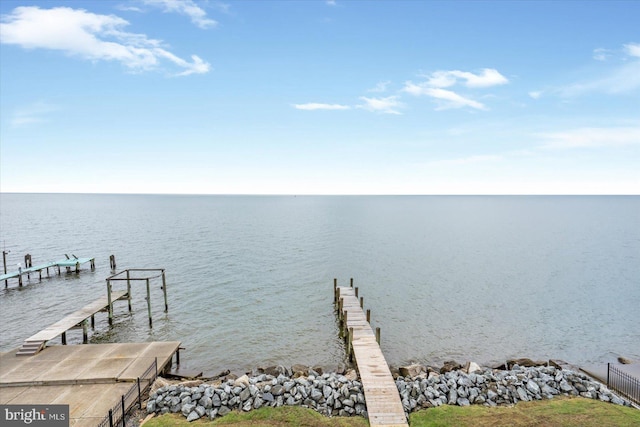 dock area with a water view