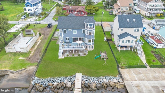 birds eye view of property with a residential view