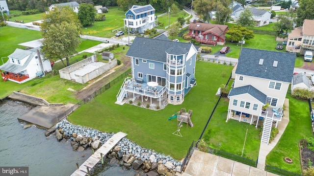 drone / aerial view featuring a water view