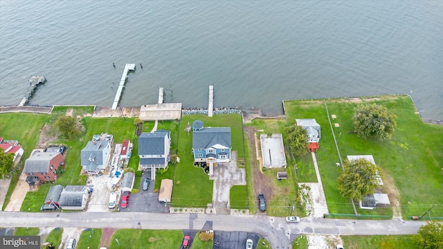 bird's eye view with a residential view and a water view