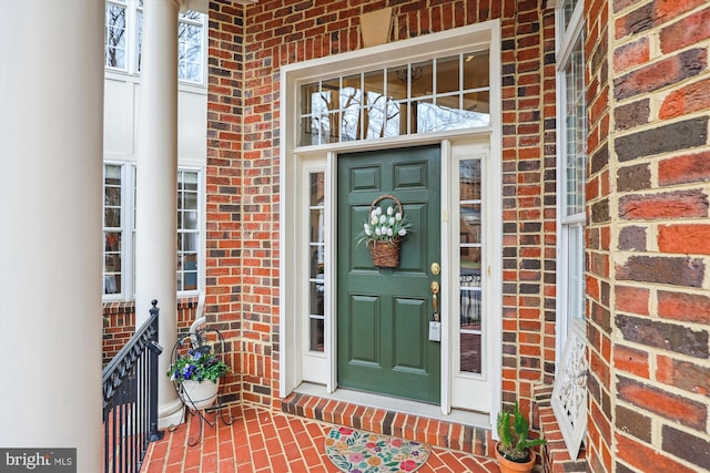 entrance to property with brick siding