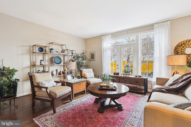 living area featuring wood finished floors and baseboards