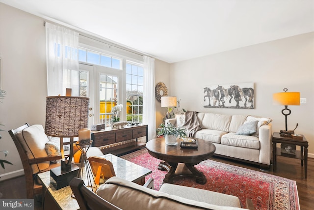 living area featuring wood finished floors and baseboards