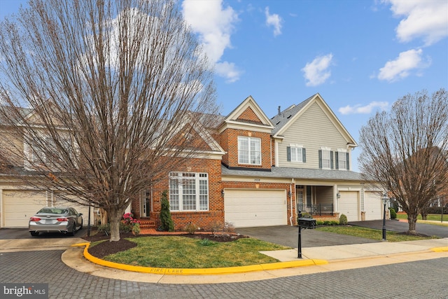 traditional-style home featuring brick siding and driveway