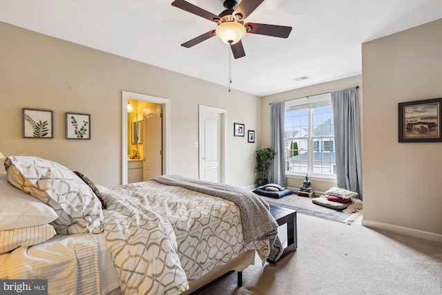 bedroom with visible vents, a ceiling fan, connected bathroom, carpet flooring, and baseboards