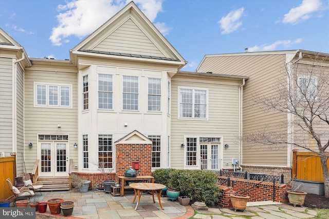 back of property featuring a patio area, brick siding, french doors, and entry steps