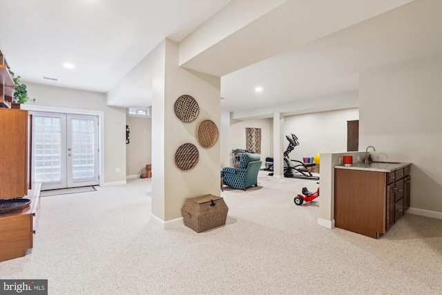 workout room with recessed lighting, french doors, baseboards, and light colored carpet