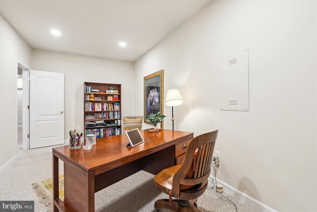 office with recessed lighting and baseboards